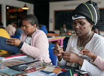 Adults concentrating on handmade learning materials