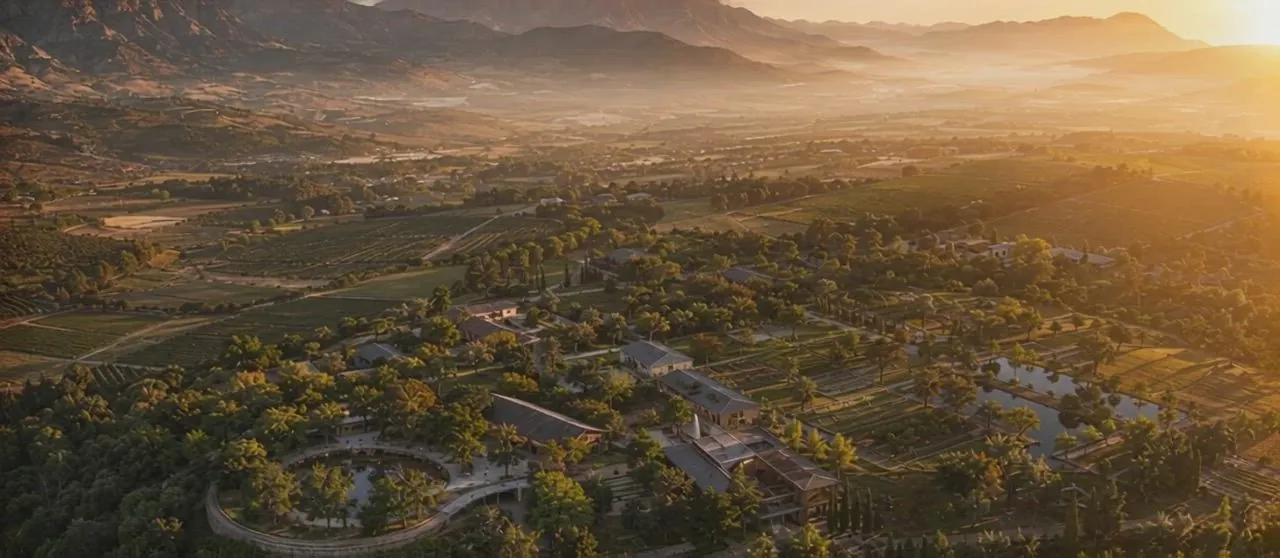 Concept illustration: Aerial view of buildings within a mountain landscape