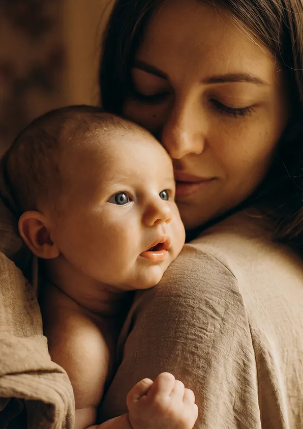 Concept illustration: Adult kissing an infant's head